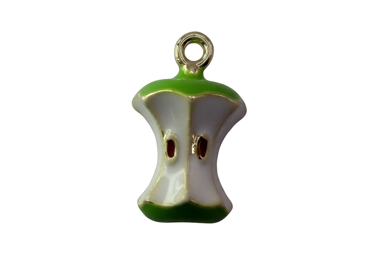 Glossy white apple core charm with green edges and gold outline, brown seed details