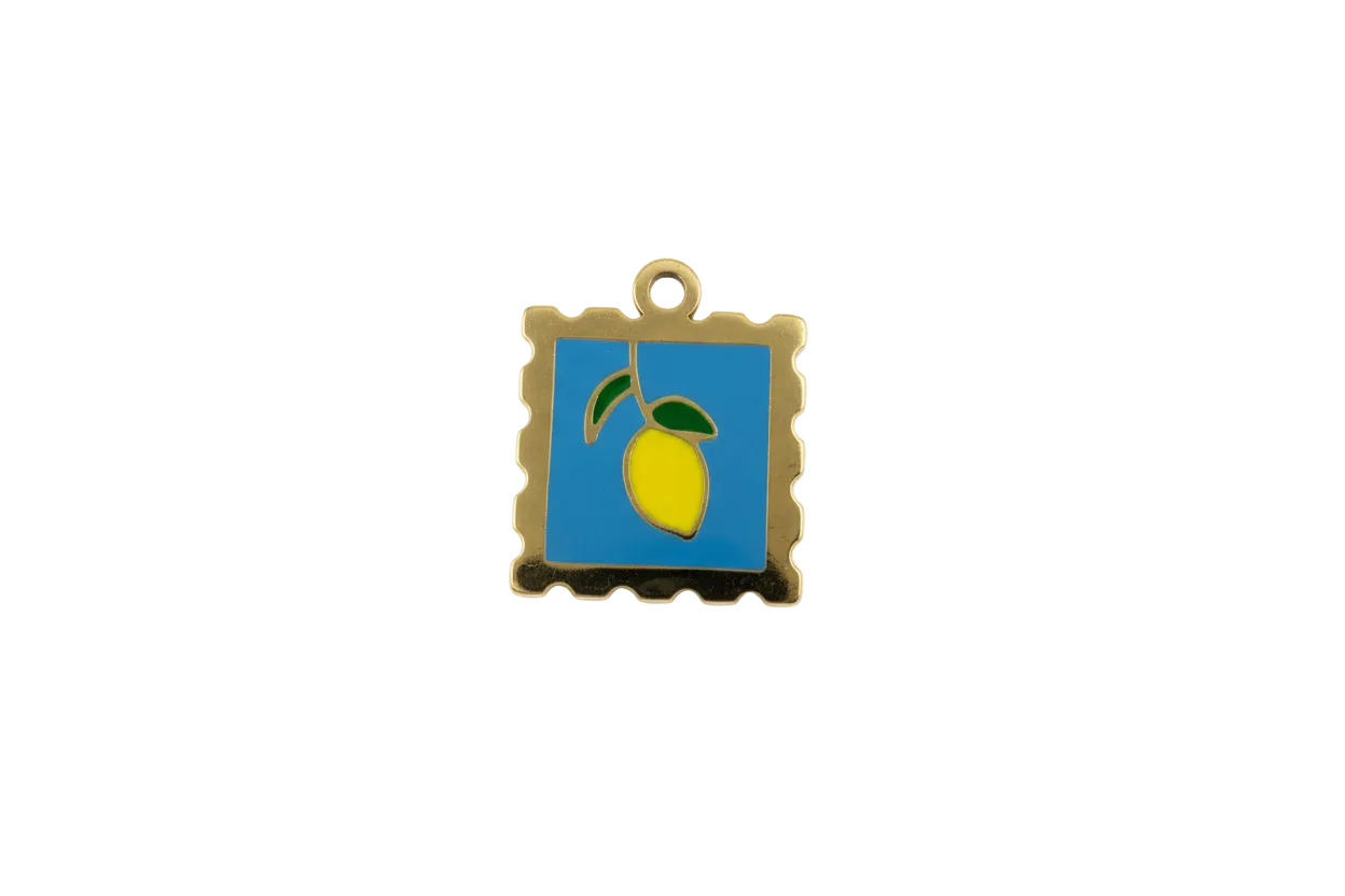 Gold stamp pendant with blue enamel and lemon motif