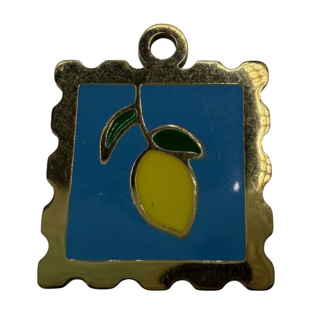 Gold-framed blue square enamel tile with yellow lemon and green leaves