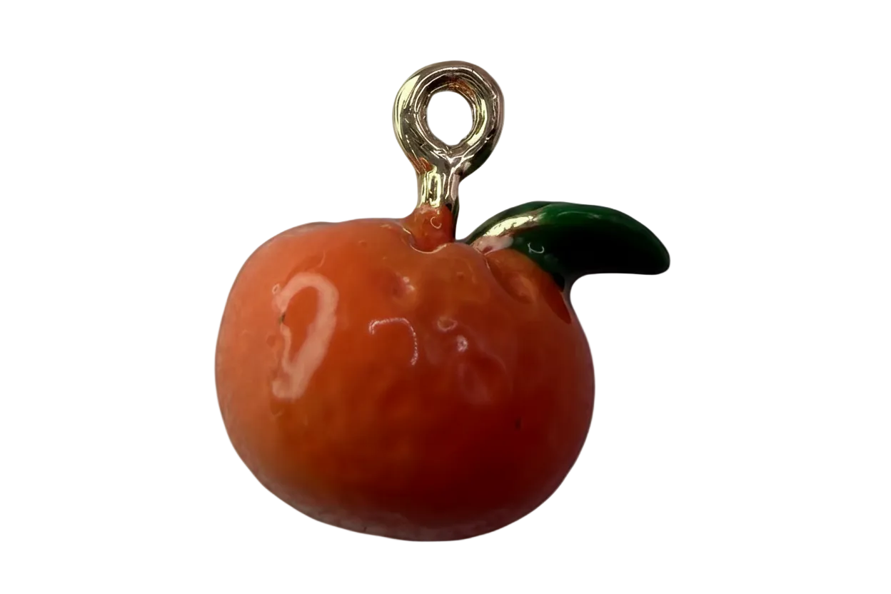 Glossy orange citrus fruit charm with green leaf and polished gold details