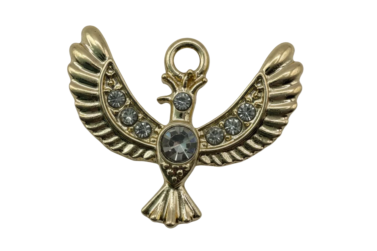 Gold winged bird charm with clear crystals and a large round center gem