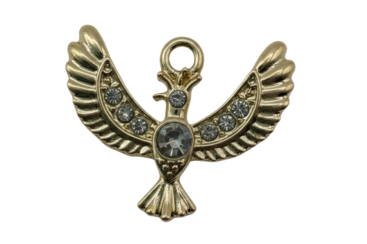 Gold winged bird charm with clear crystals and a large round center gem