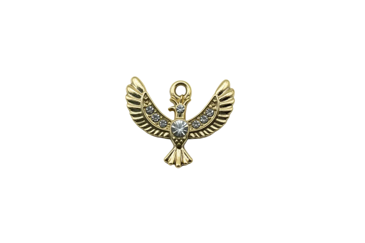 Gold winged bird with clear crystals and center gem