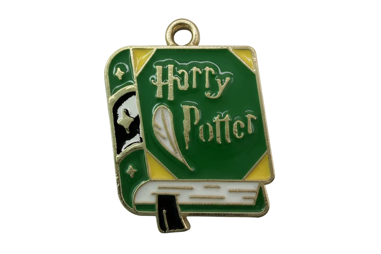 Green enamel spellbook book with gold accents and lettered cover