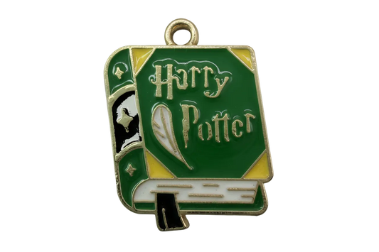 Green enamel spellbook book with gold accents and lettered cover