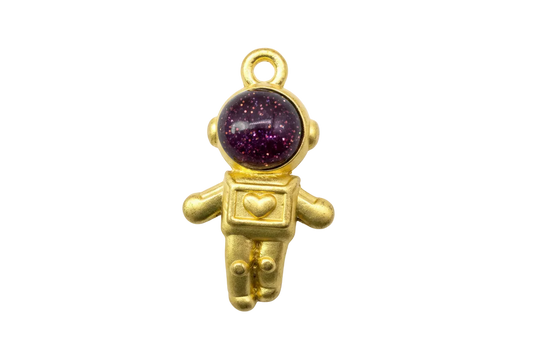 Gold astronaut charm with glossy burgundy glitter cabochon helmet and small heart chest detail