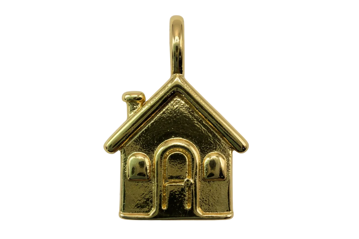 Gold house charm with pitched roof, chimney, arched door, and two windows