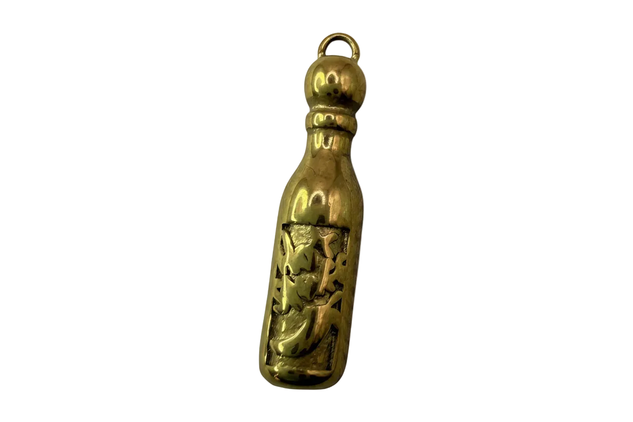 Polished gold bottle charm with cutout crescent moon and stars