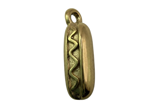 Gold hot dog pendant with raised wavy mustard line detail