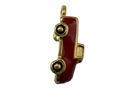 Glossy red classic car charm with gold trim and black wheels on black background