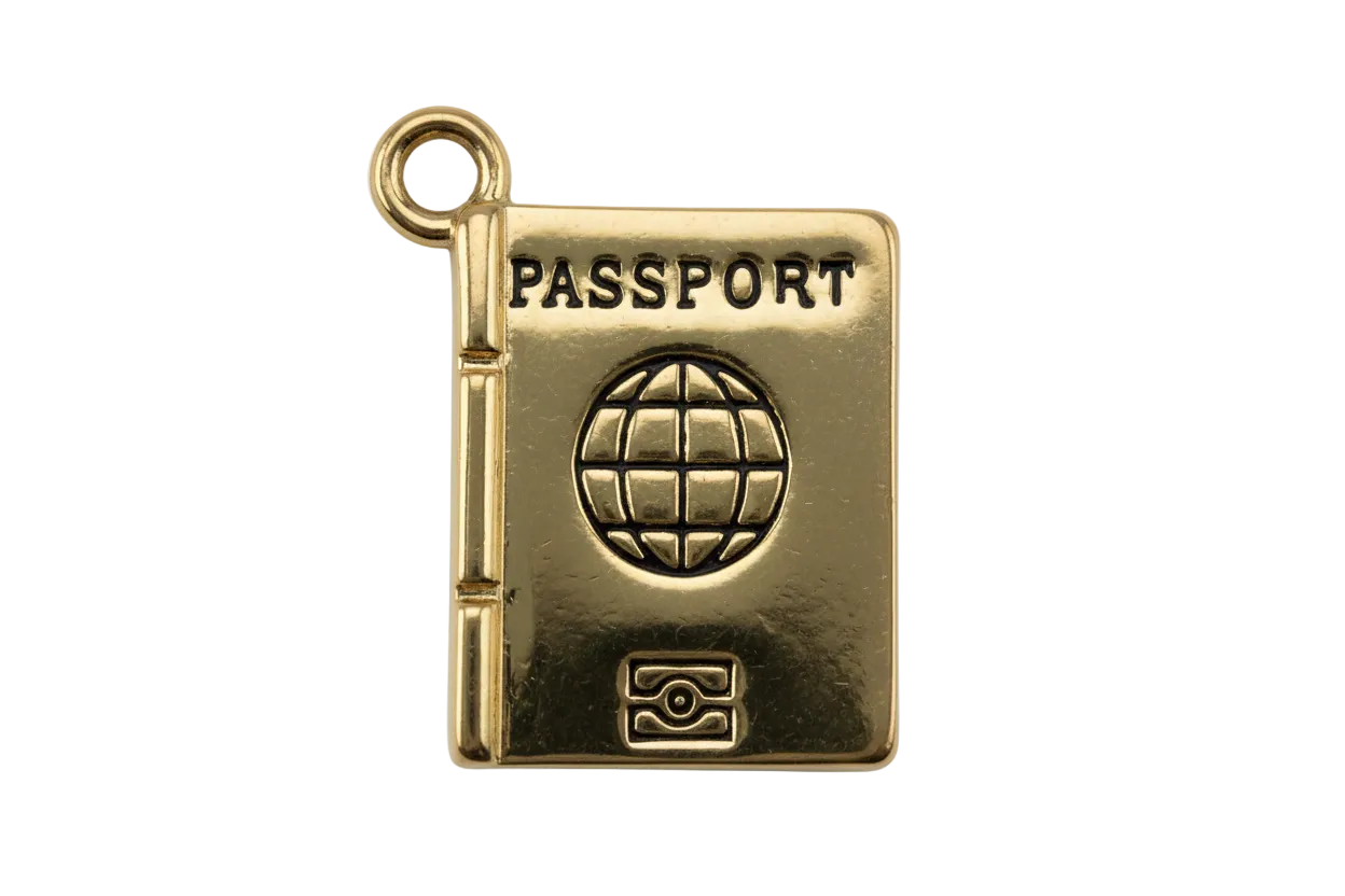 Gold passport book charm with embossed PASSPORT text and black globe emblem