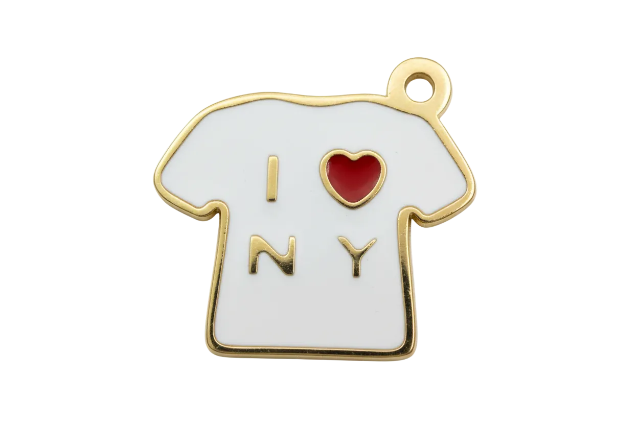 White enamel T-shirt charm with gold outline, gold letters, and a red heart detail