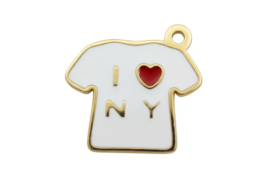 White enamel T-shirt charm with gold outline, gold letters, and a red heart detail