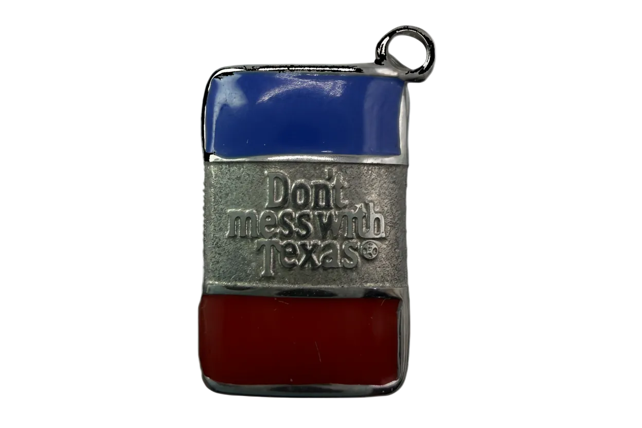 Rectangular silver tag with blue and red enamel stripes and raised “Don’t mess with Texas” lettering
