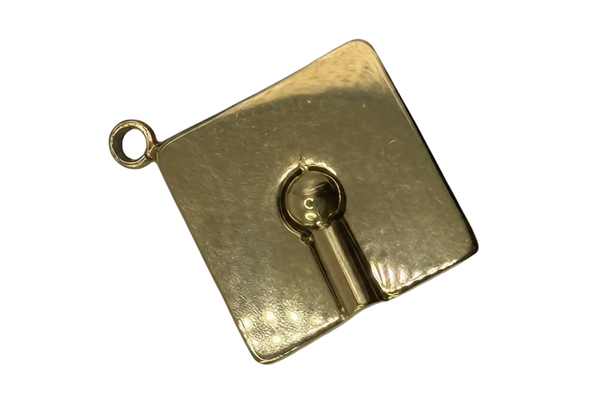 Gold square plaque with raised keyhole motif and polished finish
