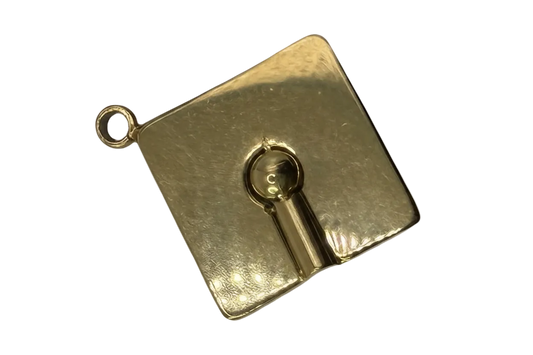 Gold square plaque with raised keyhole motif and polished finish
