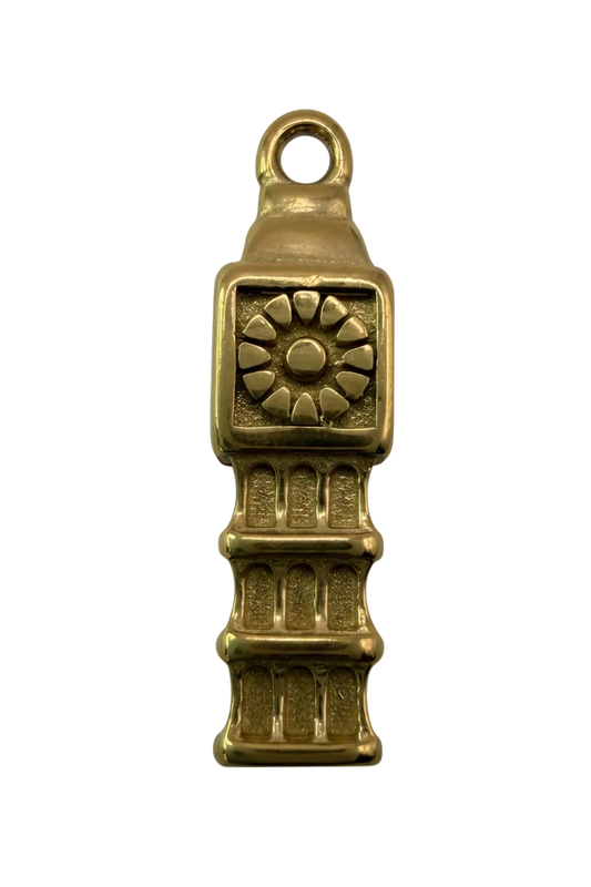 Gold sunburst bar charm with raised medallion and ribbed textured segments