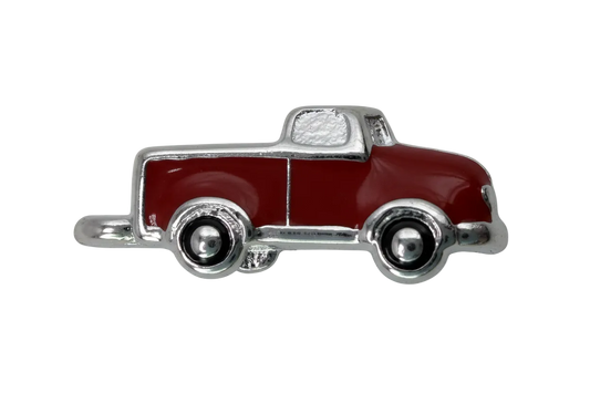 Classic red enamel pickup truck charm with silver-tone trim and black wheels, side view