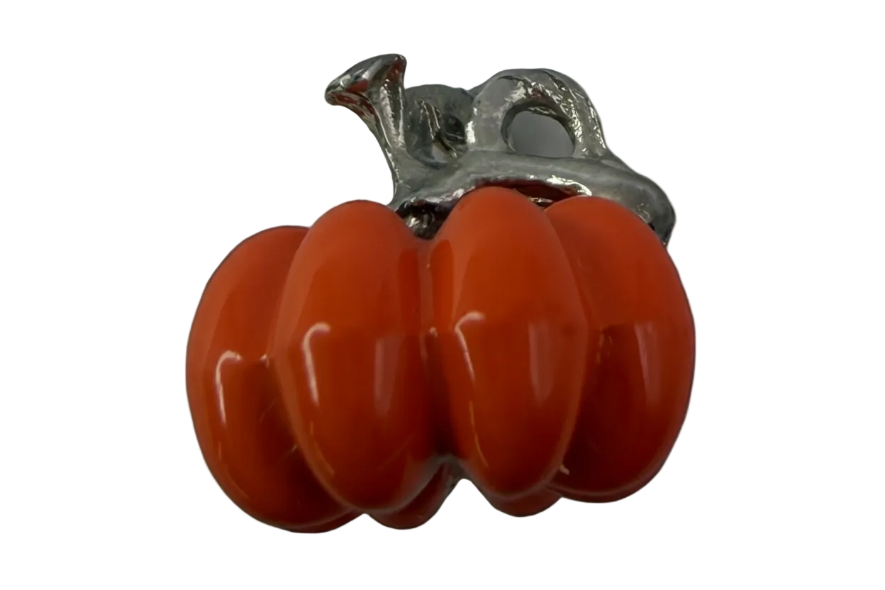 Glossy orange pumpkin charm with silver-tone stem on a black background