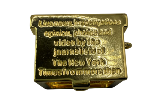 Polished gold rectangular plaque with raised text and rounded edges