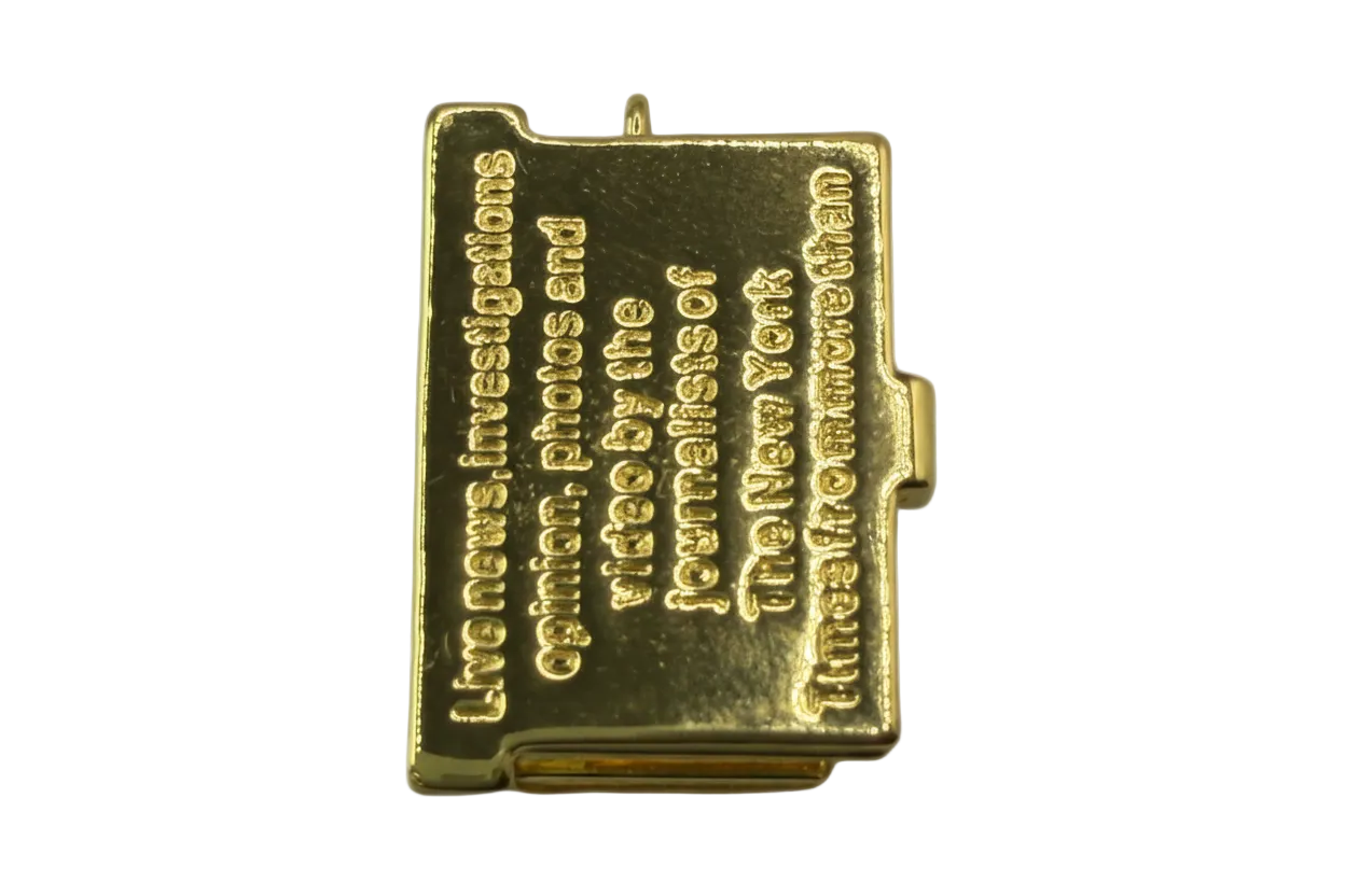 Polished gold miniature book with raised engraved quote lettering