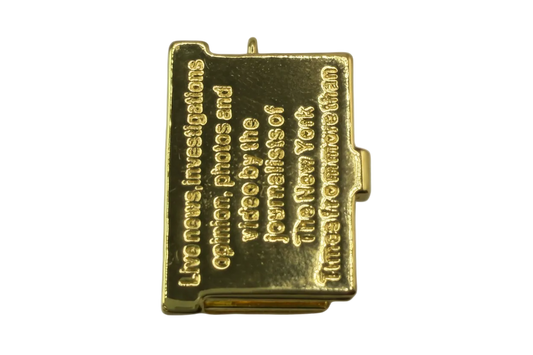 Polished gold miniature book with raised engraved quote lettering