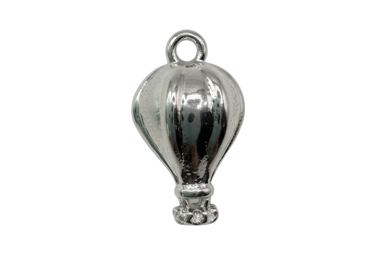 Polished silver hot air balloon charm with sculpted paneling and small basket detail