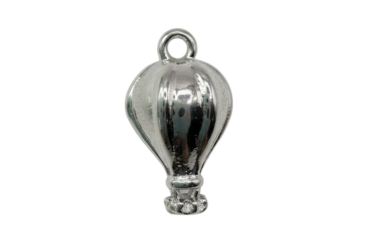 Polished silver hot air balloon charm with sculpted paneling and small basket detail