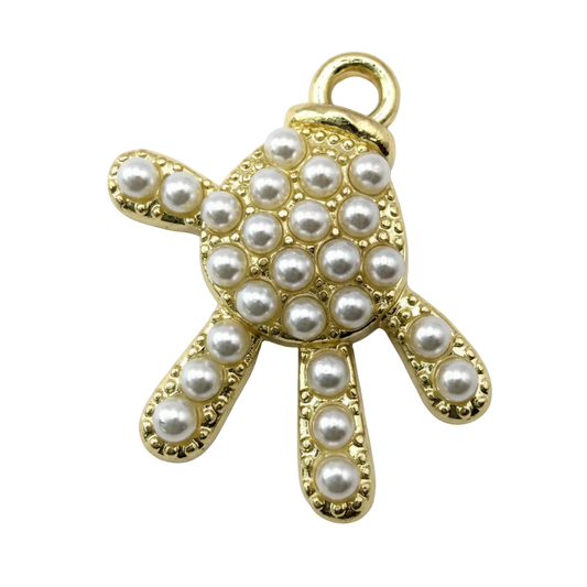 Gold teddy bear charm with pearl-like bead accents and textured border