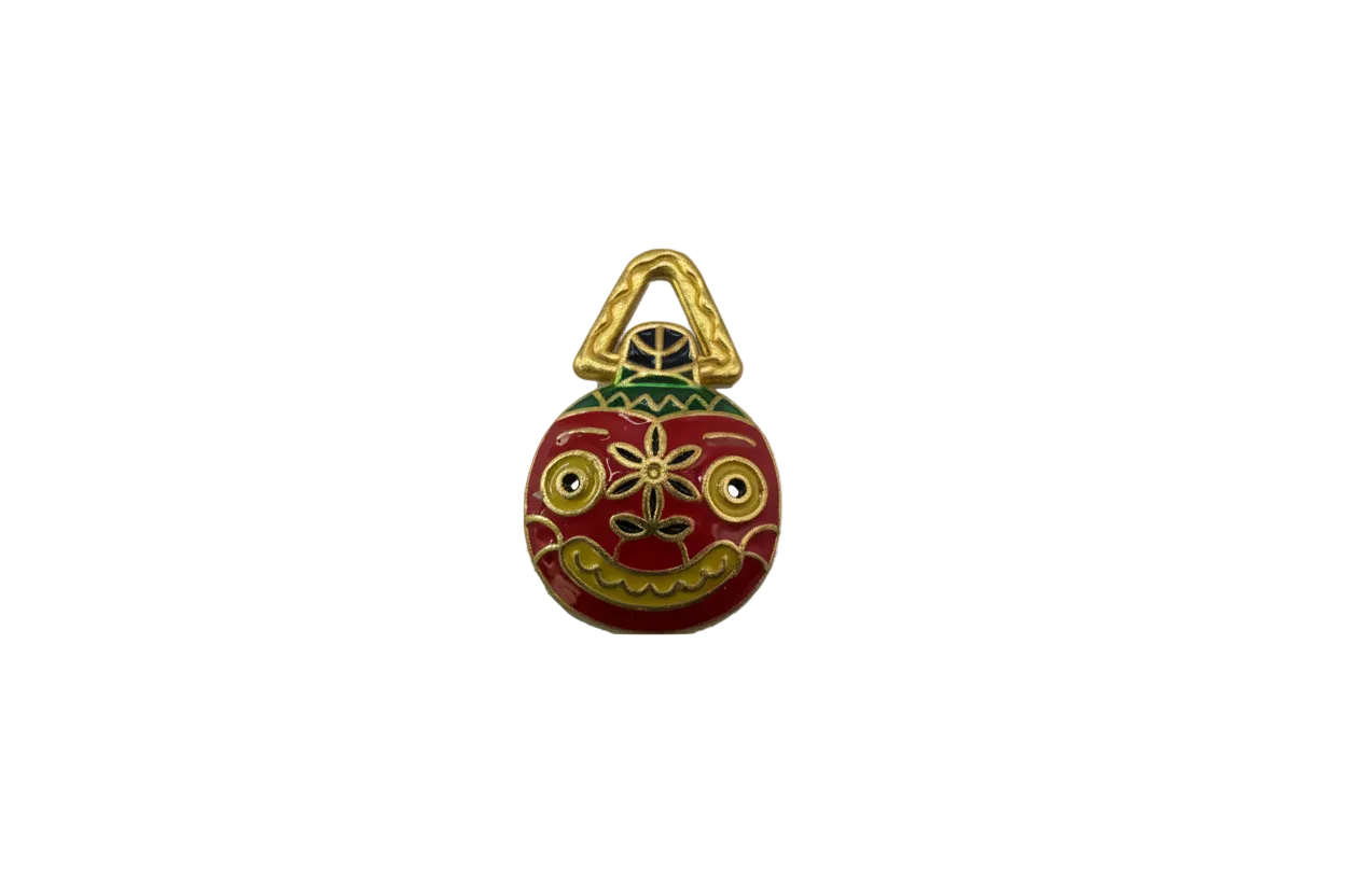 Red enamel folk mask with gold details and yellow eyes