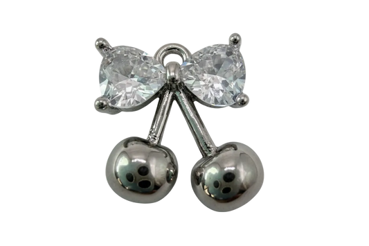 Polished silver cherry pair with faceted clear bow gem accent