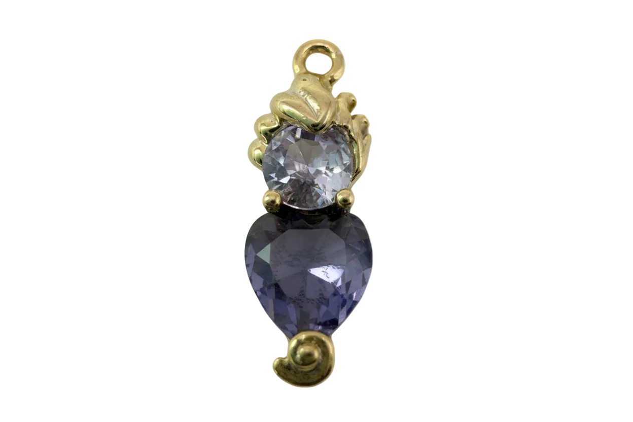 Gold-finish two-stone piece with faceted violet heart crystal and pale lavender round crystal