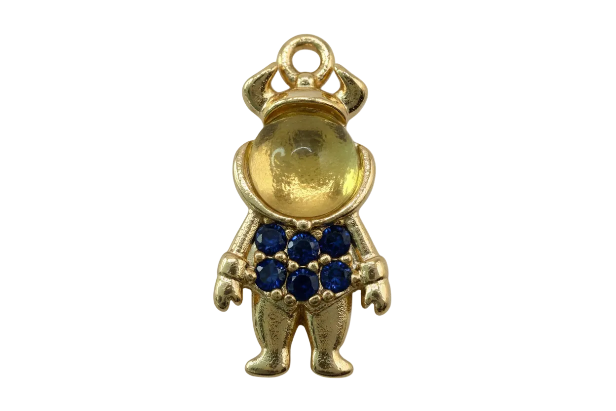 Gold teddy bear figure with a cluster of deep blue pavé gems on the front