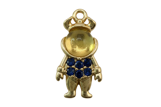 Gold teddy bear figure with a cluster of deep blue pavé gems on the front