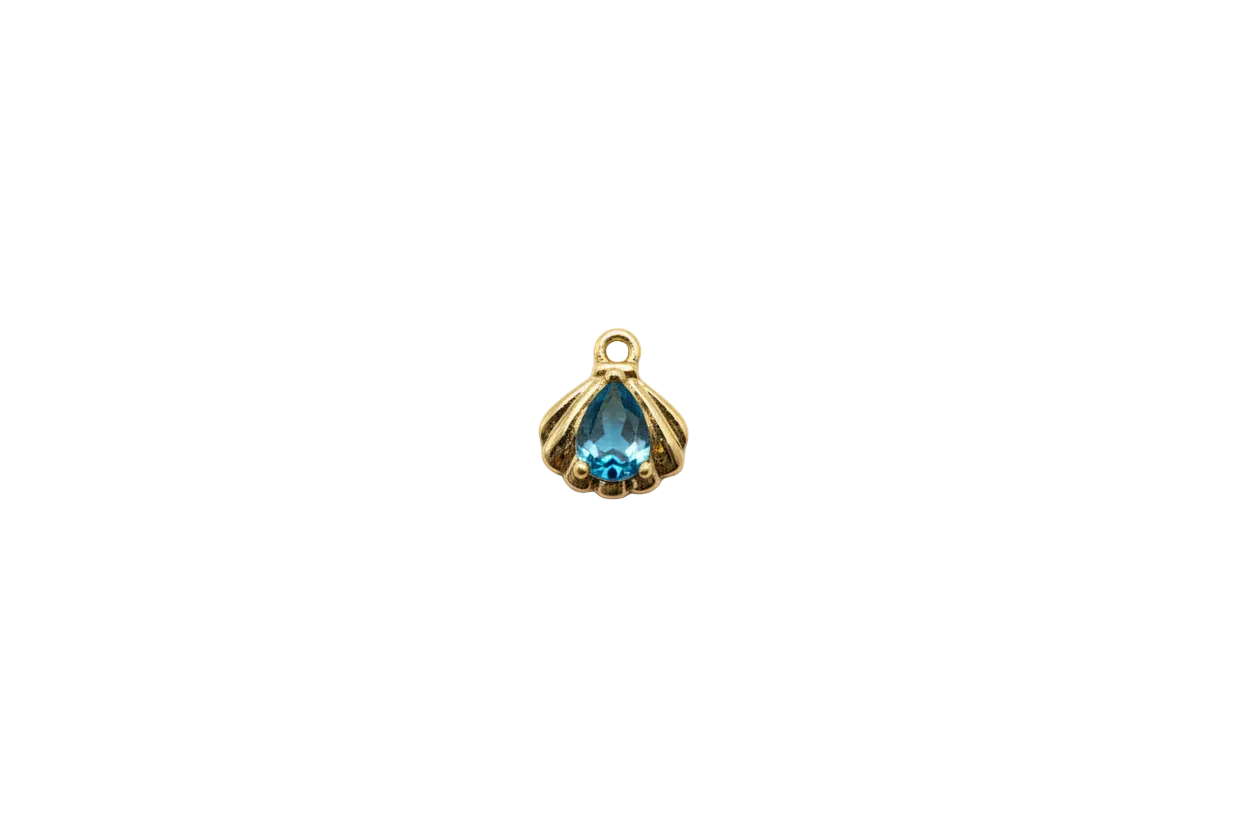 Gold scallop shell with blue teardrop gem