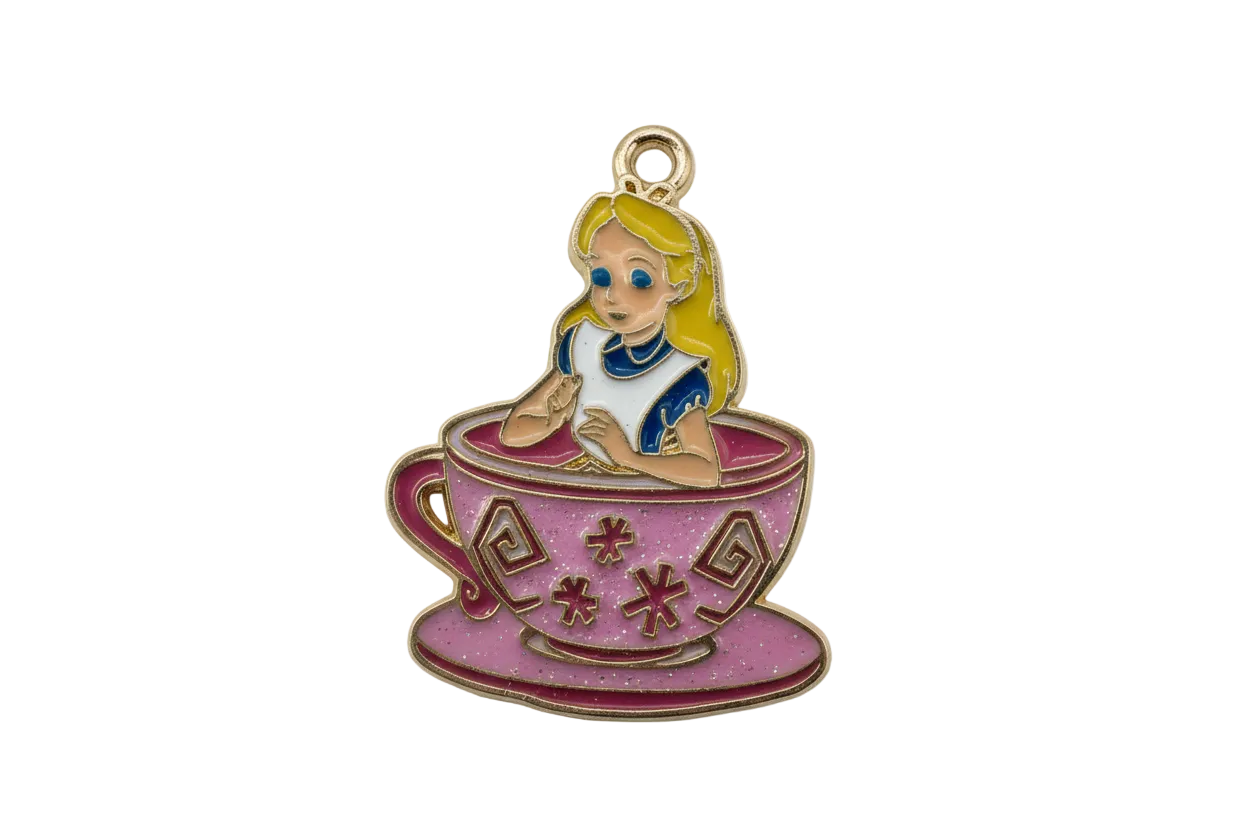 Gold-edged enamel charm of a blonde girl in a pink teacup with blue dress details
