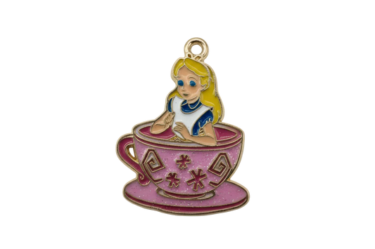 Gold-edged enamel charm of a blonde girl in a pink teacup with blue dress details