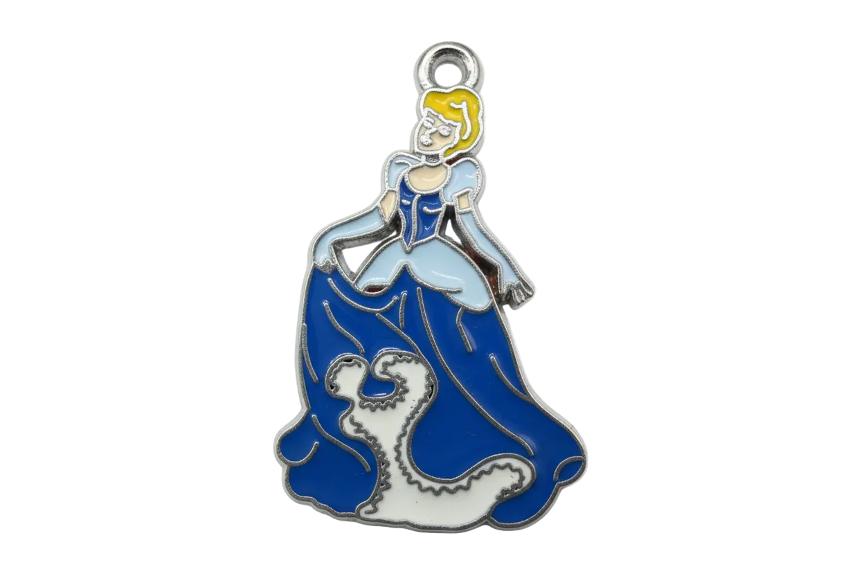 Blue and white enamel ocean wave with a surfer figure, silver-tone outline and yellow hair