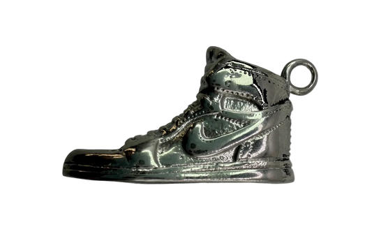 Polished silver high-top sneaker charm with sculpted tread and lace details