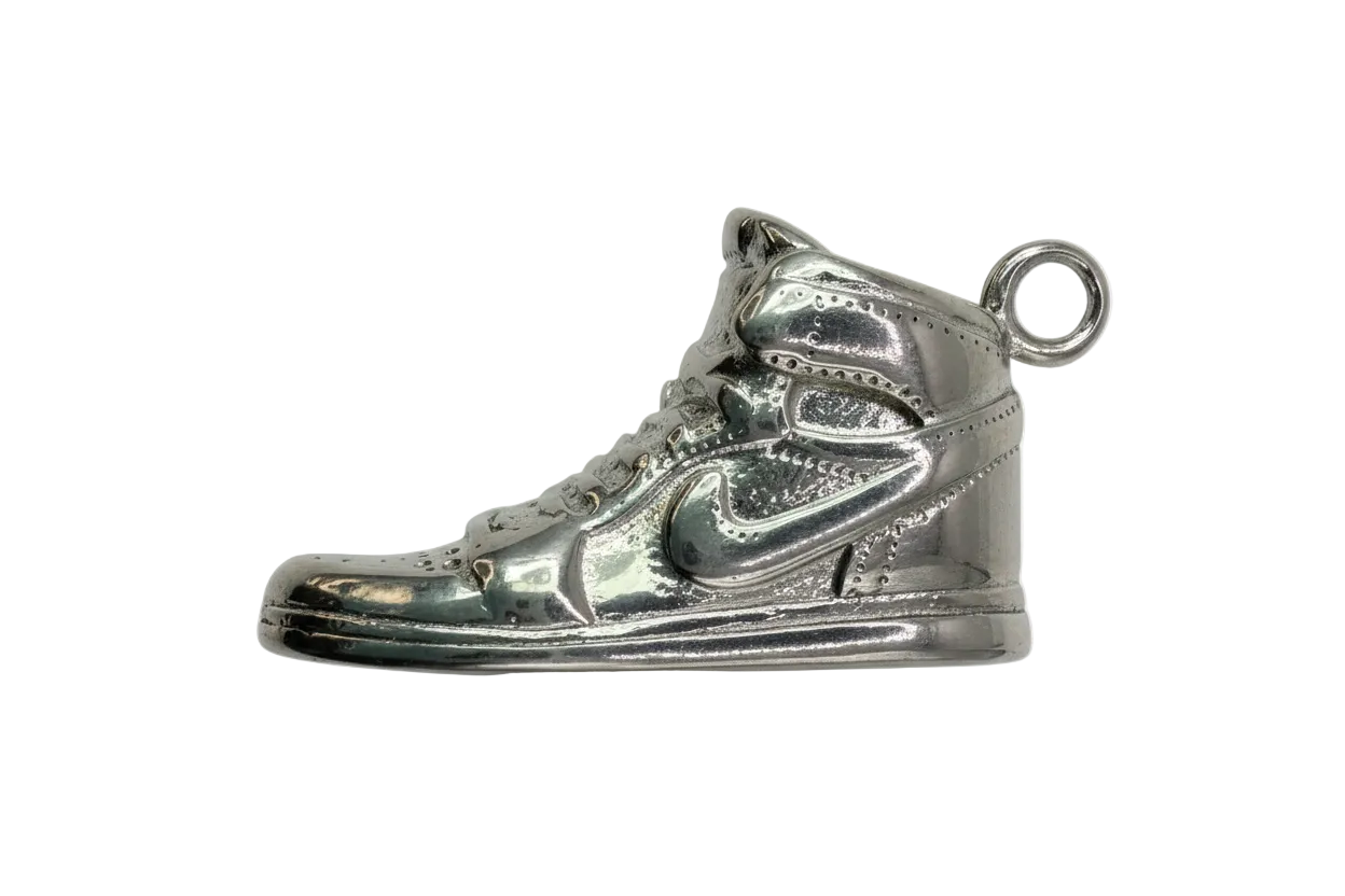 Polished silver high-top sneaker charm with sculpted laces and panel detailing