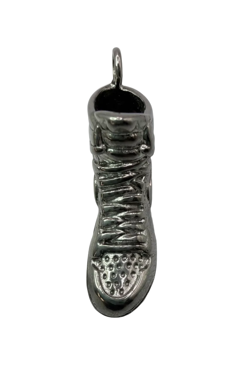 Silver-tone sneaker pendant with textured laces and sole tread, oxidized details