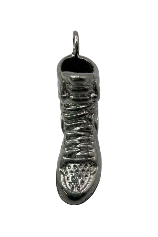 Silver-tone sneaker pendant with textured laces and sole tread, oxidized details