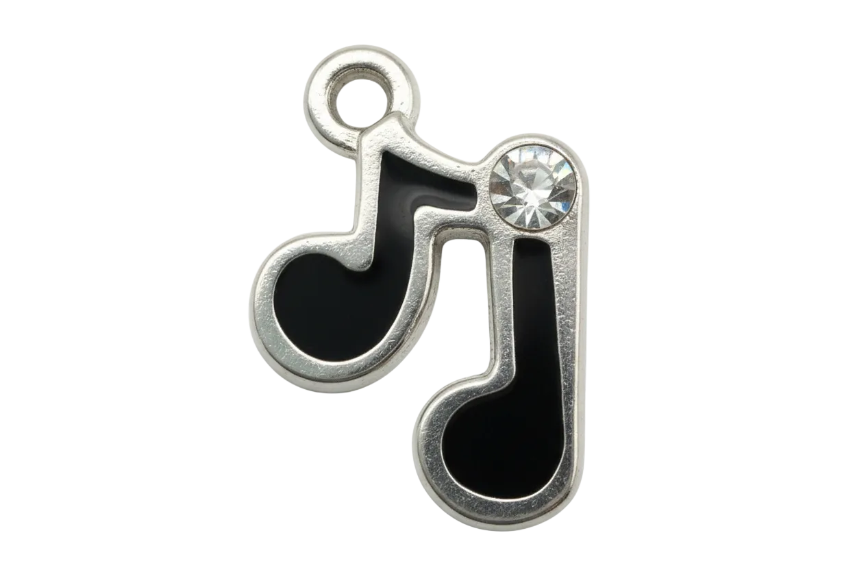 Black enamel music note charm in silver finish with a clear faceted gem accent