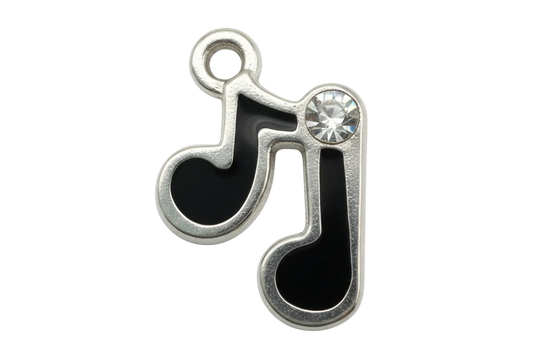 Black enamel music note charm in silver finish with a clear faceted gem accent