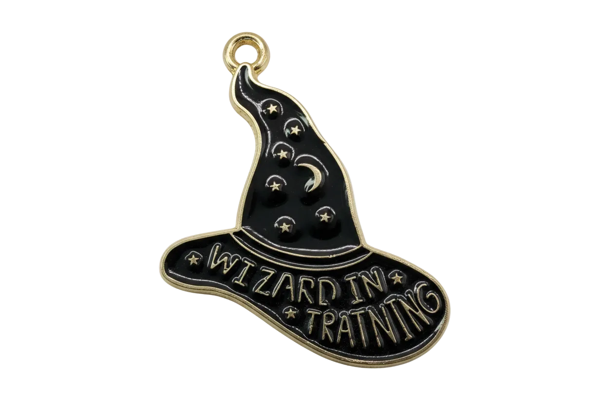 Black enamel witch hat plaque with gold outline, stars, crescent moon, and “Wizard in Training” text