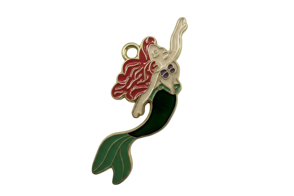 Glossy enamel mermaid figure with red hair, purple top, and green tail, outlined in gold