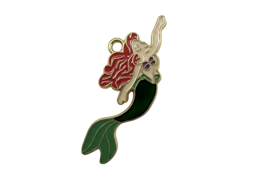Glossy enamel mermaid figure with red hair, purple top, and green tail, outlined in gold