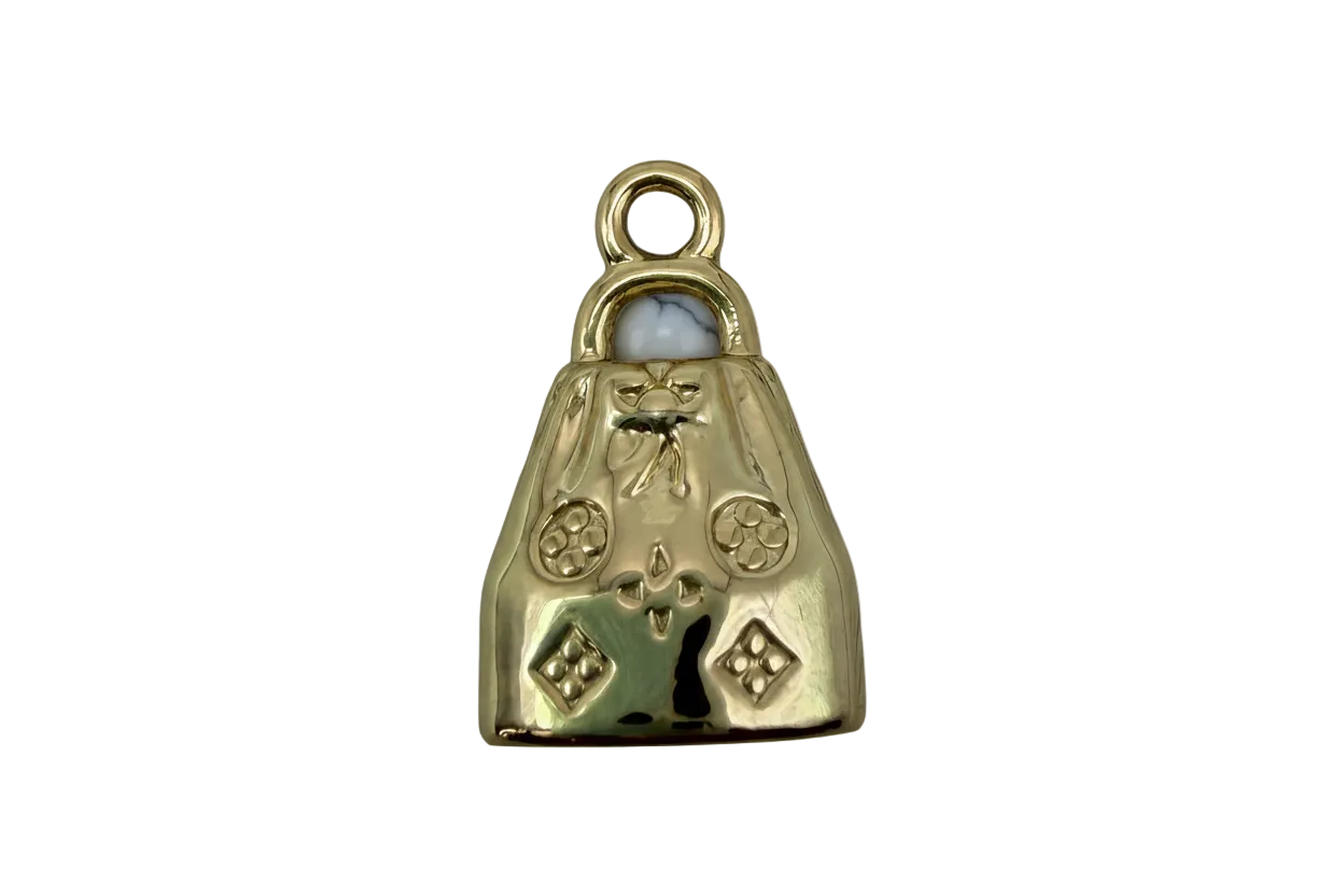 Polished gold handbag pendant with sculpted bow and stud details