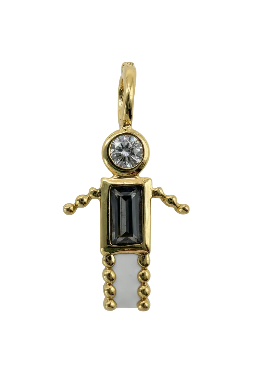 Gold pistol charm with skull details, black rectangular inlay, and clear round gem