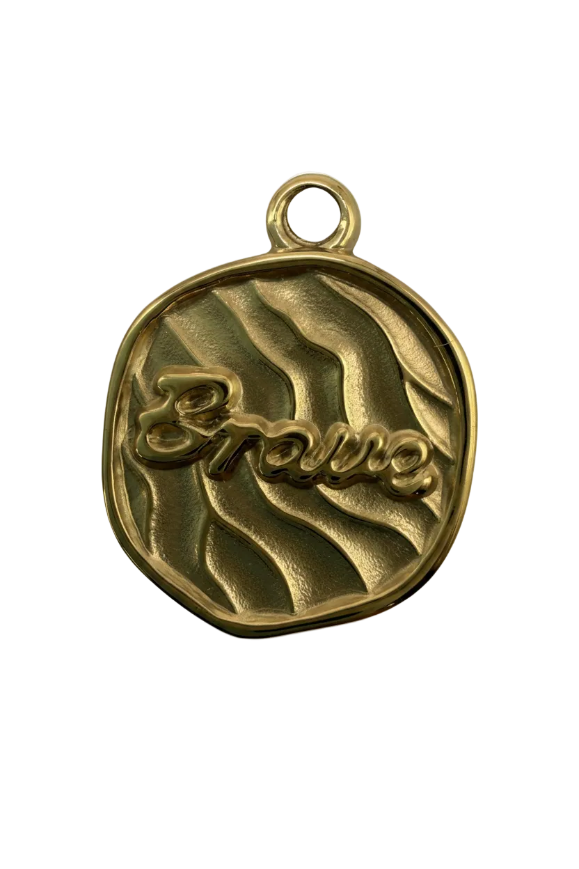 Gold textured coin with raised “amour” script and wavy pattern